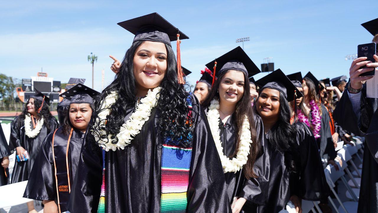 Ventura College students smile at the commencement ceremony